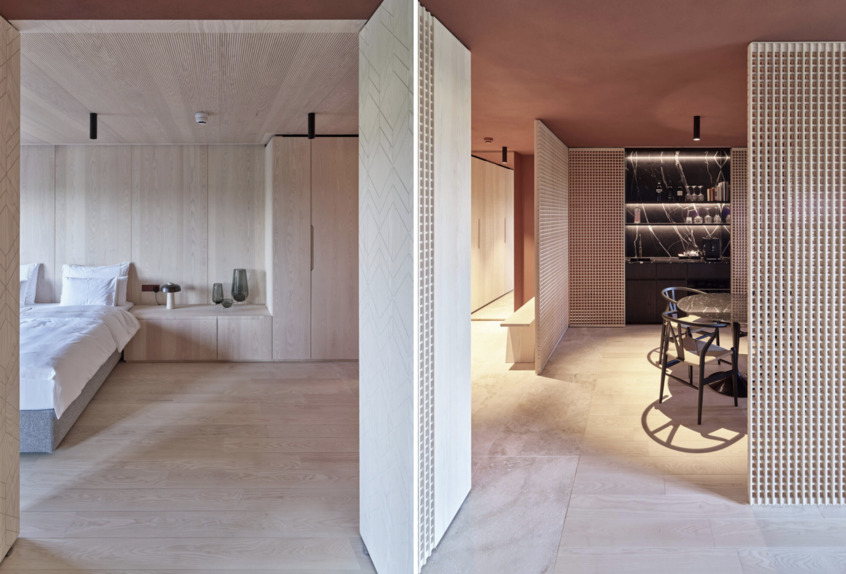 alt: "materialiedesign-fritsjurgens-system_M_reiters_supreme_suite_behf-architects_foto_kurt.hoerbst_camera_soggiorno_porte_bilico"